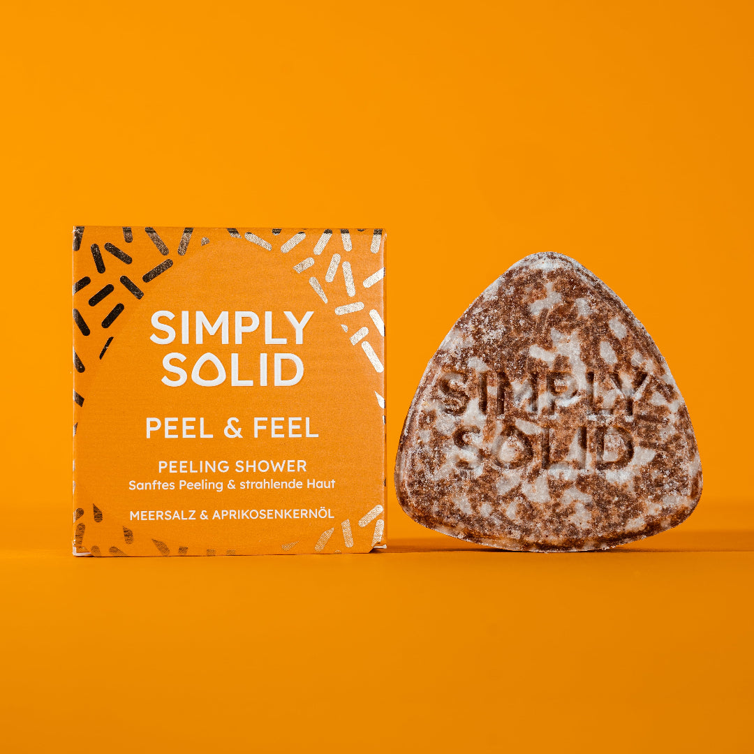 Peel & Feel Solid mit Verpackung vor orangem Hintergrund