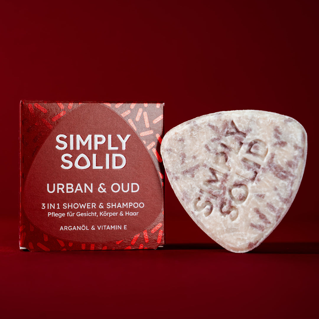 Urban and Oud Solid mit Verpackung vor einem tiefroten Hintergrund